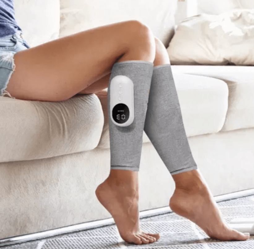 Woman relaxing on sofa with ThermoCalf-Pro™ electric calf massager for pain relief and relaxation. ZIMOKE beauty and health care.